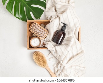 Brown bottle mockup for bathing products in the bathroom, spa shampoo, shower gel, liquid soap on cotton towel and various accessories flat lay. Top view. copy space - Shutterstock ID 1864859896