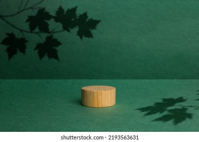 brown box made of precious wood, block, cylindrical podium, branch with maple leaves on a green background. conceptual autumn scene, stage showcase, product, promotion - Shutterstock ID 2193563631