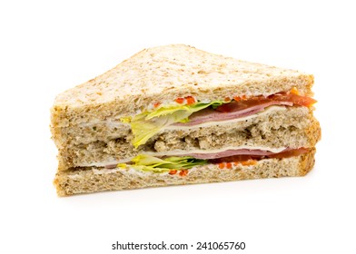 Brown bread Sandwich with ham, cheese and salad. On white background.