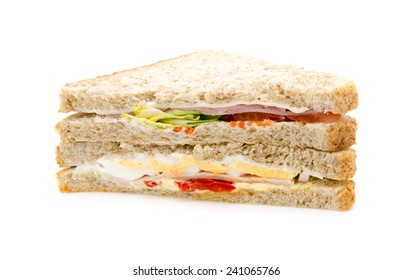 Brown Bread Sandwich With Ham, Cheese, Turkey, Egg And Salad. On White Background.