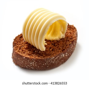 Brown Bread Slice And Butter Curl Isolated On White Background