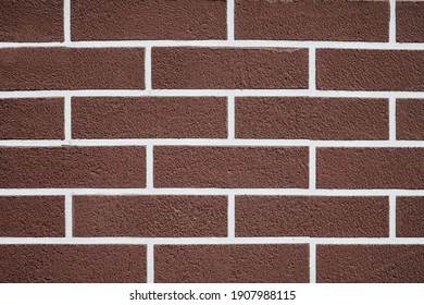 Brown Brick Wall With White Grout Lines Pattern. Abstract Brick Texture Background. New House Exterior. Loft Design.