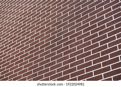 Brown Brick Wall With White Grout Lines Pattern. Abstract Brick Texture Background. New House Exterior. Loft Design.