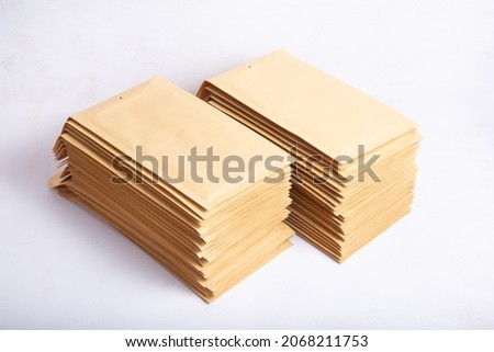 Lot of brown bubble envelopes on the office desk