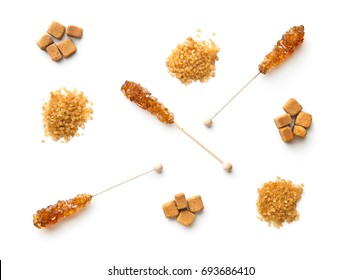 Brown Cane Sugar, Cube Sugar And Crystalic Sugar On Wooden Sticks Isolated On White Background. Top View.