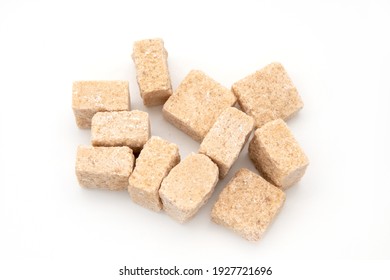 Brown Cane Sugar Cubes Isolated On White