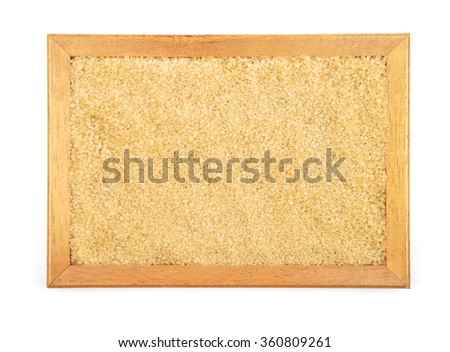 Brown cane sugar in frame