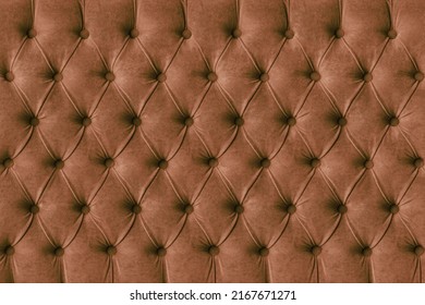 Brown capitone checkered soft fabric textile decorative background with buttons. Classic retro Chesterfield style, luxurious upholstery buttoned texture for furniture, wall, headboard, sofa, couch