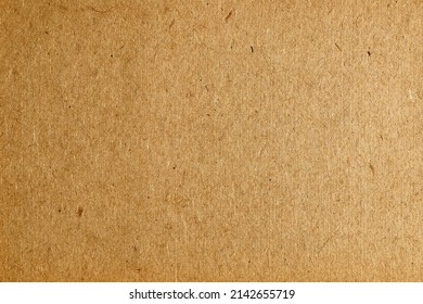 Brown cardboard background, flawed paper texture.