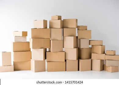 brown cardboard boxes stacked on each other on white 