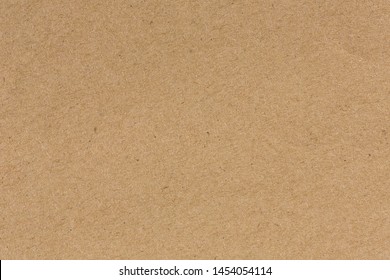 Brown cardboard sheet of paper background - Shutterstock ID 1454054114