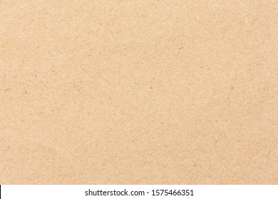 Brown cardboard sheet of paper background - Shutterstock ID 1575466351