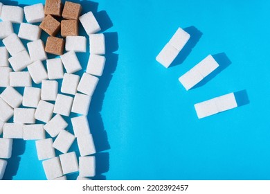 Brown Caries Sugar On White Tooth On Blue Background Closeup. High Quality Photo