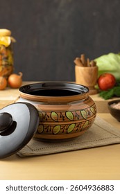 Brown ceramic baking dish with pattern on kitchen table