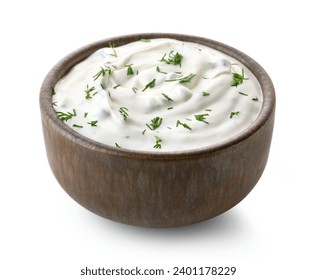 Brown ceramic bowl of fresh sour cream dip sauce with herbs isolated on white background - Powered by Shutterstock