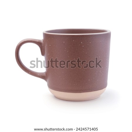 Brown ceramic cup isolated on white.