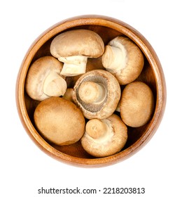 Brown Champignons, In A Wooden Bowl, Isolated, From Above. Raw, Young Mushrooms, Agaricus Bisporus, Known As Swiss, Roman Or Italian Brown Mushroom, Cremini Or Chestnut Mushroom Or Also As Baby Bella!