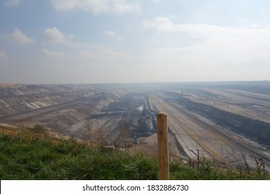 Brown Coal Lignite Opencast Mining. Fossil Fuels In Germany. Landscape With A Lot Of Dirt. Energy Sector Environment Destruction Concept Image.