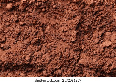 Brown cocoa powder texture. Cocoa powder background.
