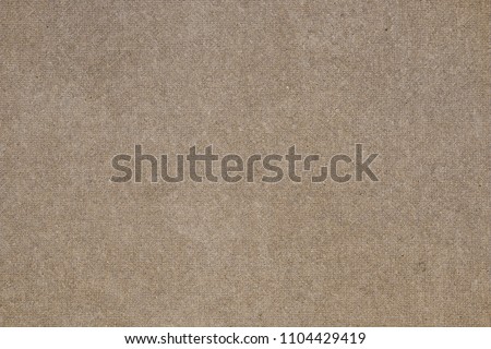 Brown concrete floor texture with small dash pattern. Close-up photo of scabrous background. Horizontal orientation