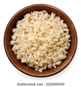 Brown cooked rice in a brown wood bowl isolated on white. Top view. - Shutterstock ID 2226969429