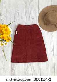 Brown Corduroy Mini Skirt On Wooden Background