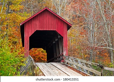 Brown County Indiana's Bean Blossom Covered Bridge, built in 1880 and seen here surrounded by colorful fall foliage, is a very rare example of a Howe single truss structure.