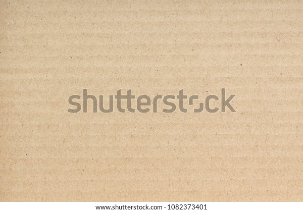 Brown craft cardboard paper sheet of recycle\
paper background and\
texture.