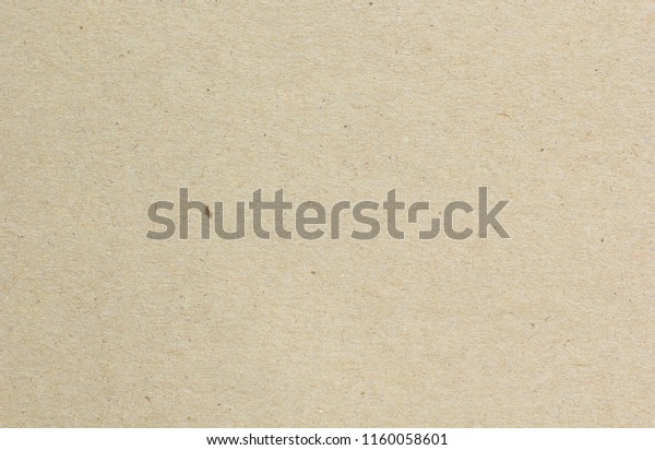 Brown craft cardboard paper sheet of recycle
paper background and
texture.