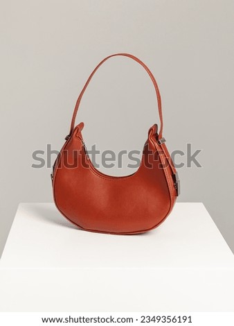 Brown cross body bag on white background. Artificial leather