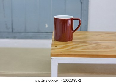 brown cup on the table