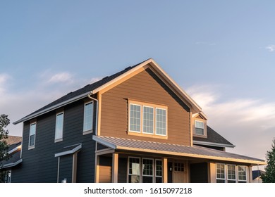 Brown Double Storey House Facade In Evening Light