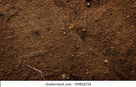 Brown earth. Red soil. Clay soil. Earth texture. Soil texture. Earth background. Earth texture.