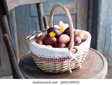 Brown Easter eggs dyed with onion peels  in a basket. Holidays traditional background