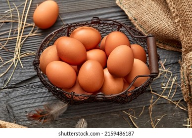 Brown eggs on rustic background