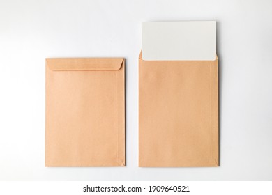 Brown envelope front and back isolated on white background. Letter top view. Envelope template mock up. - Shutterstock ID 1909640521