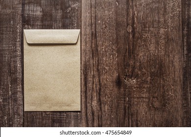 Brown envelope on old wooden table