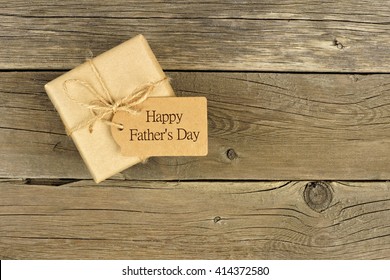 Brown Fathers Day Gift Box With Tag On A Rustic Wood Background