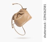 A brown female handbag with straps flying on a gray background. Minimalistic layout with bag. Advertising for ladies store, blog. Trendy women