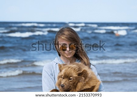 Similar – Junge Frau mit blondem Labrador am Ostseestrand