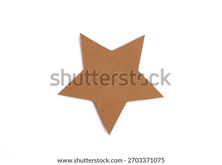 Brown five-pointed star shape cut from cardboard isolated on white background