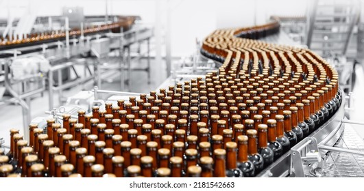 Brown glass beer drink alcohol bottles, brewery conveyor, modern production line. - Shutterstock ID 2181542663