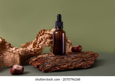 Brown glass bottle of cosmetic product or oil on wood and paper on green background. Natura Spa Cosmetic Beauty concept , ecology and natural beauty  - Shutterstock ID 2070796268