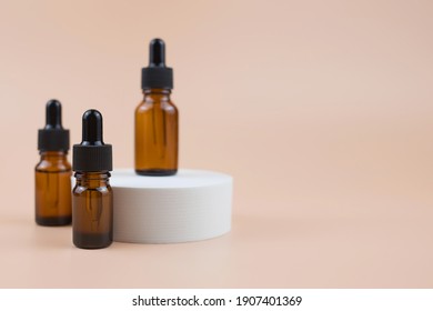 Brown glass bottles with serum, essential oil or other cosmetic product. Natural organic cosmetic packaging, skin care concept. - Shutterstock ID 1907401369