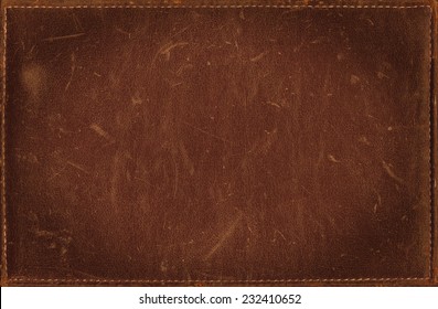 Brown grunge background from distress leather texture
