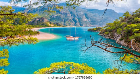 Brown gulet anchored at the Aegean sea - Panoramic view of Oludeniz Beach And Blue Lagoon, Oludeniz beach is best beaches in Turkey - Fethiye, Turkey - Powered by Shutterstock