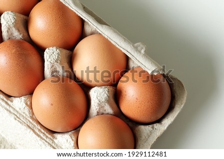 brown hen eggs in carton box
