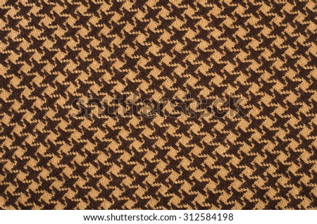 Brown houndstooth wool pattern. Dogstooth check design as background.