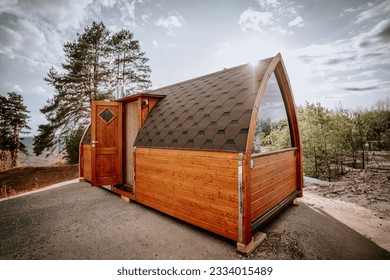 Brown igloo sauna during sunny summer weather