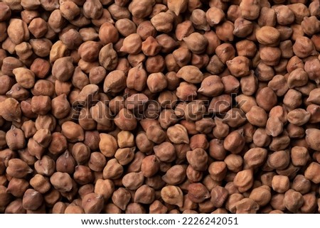 Brown Indian Kala Chana chickpeas close up full frame as background